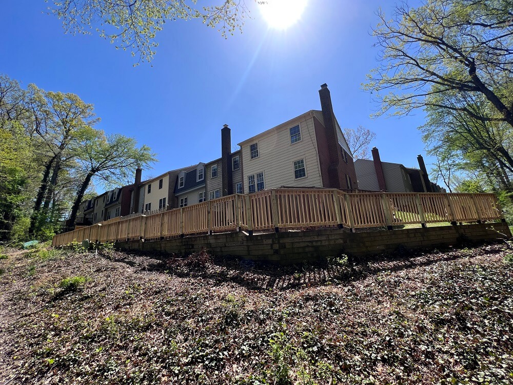 Long Wooden Fence Project by Atlas General Contractors - Chantilly, Virginia